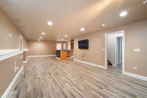 Unfurnished living room with light hardwood / wood-style floors