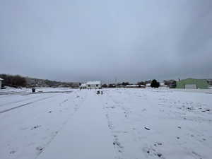 View of yard layered in snow