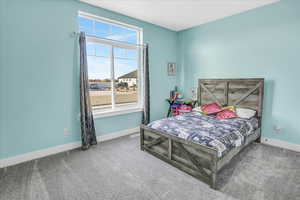 Bedroom featuring carpet