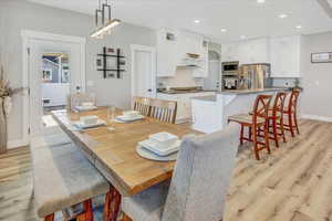 Dining room with light hardwood / wood-style floors