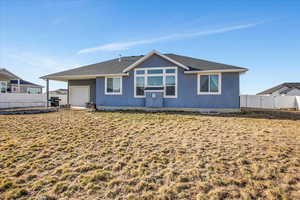 Back of house with a garage