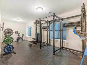 Workout area featuring a textured ceiling