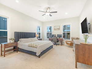 Bedroom featuring light carpet and ceiling fan