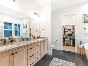 Bathroom featuring a bathtub and vanity