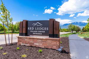 Community / neighborhood sign featuring a mountain view