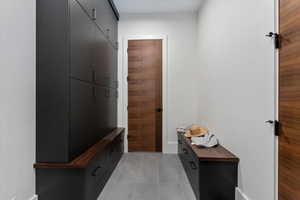 Mudroom featuring light tile patterned flooring