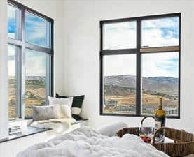 Primary bedroom with multiple windows