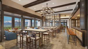 Dining area with beam ceiling, a mountain view, light hardwood / wood-style flooring, and a chandelier