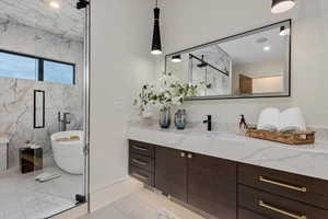 Bathroom featuring tile patterned floors, vanity, and independent shower and bath