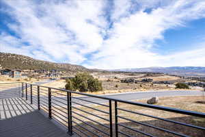 Wrap around deck featuring a mountain view