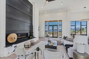 mtn views fill the great room, soaring ceiling height, steel fireplace