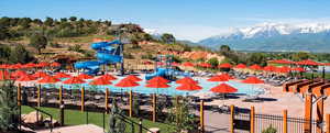 View of pool featuring a mountain view and a playground