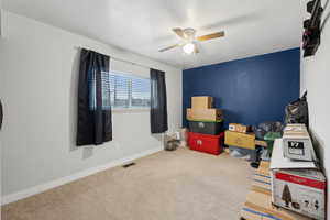 Playroom featuring carpet flooring and ceiling fan