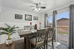 Dining area with ceiling fan and wood-type flooring