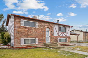 View of front of home featuring a front lawn