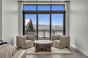 Living room featuring a mountain view and light hardwood / wood-style floors