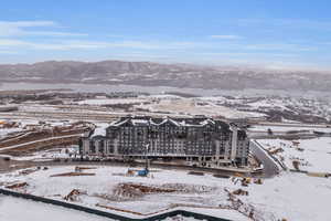 Snowy aerial view featuring a mountain view