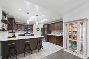 Kitchen featuring decorative light fixtures.