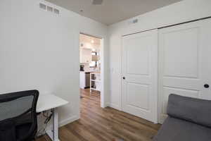 Office area with dark wood-type flooring