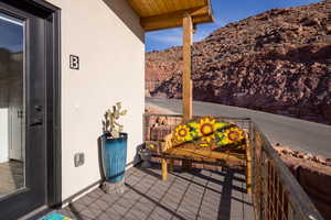 View of patio featuring a balcony