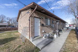 View of front of property with central AC and a front lawn