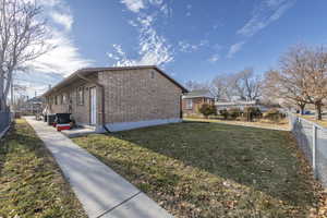 View of home's exterior featuring a lawn