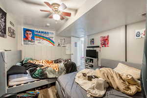 Bedroom featuring wood-type flooring, a textured ceiling, and ceiling fan