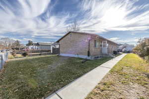 View of home's exterior with a lawn