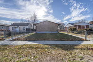 View of side of home with a lawn