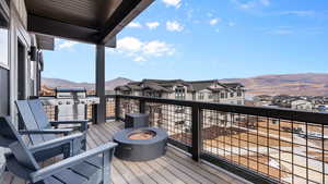 Deck featuring a mountain view and a grill