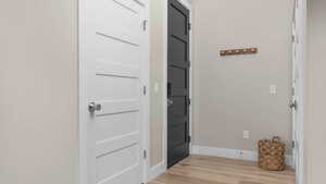 Entryway with light hardwood / wood-style floors