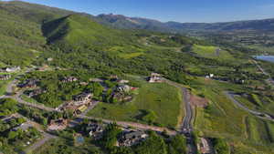 Aerial view of property's location with a mountain backdrop