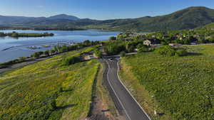 Aerial overview of property's location with a water and mountain view