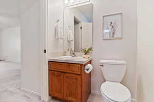 Bathroom featuring vanity and toilet