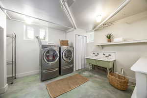 Washroom with separate washer and dryer and sink