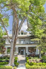 View of front of home with a balcony and covered porch