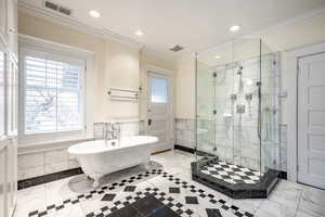 Bathroom with plus walk in shower and crown molding