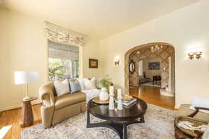 Living room with wood-type flooring