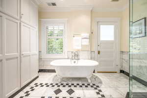 Bathroom with separate shower and tub and crown molding