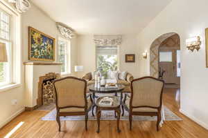 Dining area with light hardwood / wood-style flooring