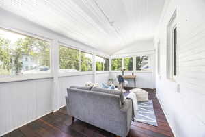 Sunroom / solarium featuring a wealth of natural light and vaulted ceiling