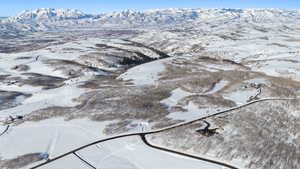 Snowy aerial view with a mountain view