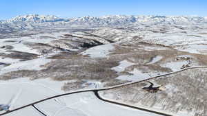 Snowy aerial view with a mountain view