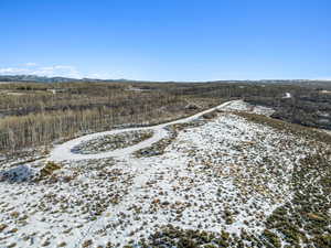 Snowy aerial view featuring a mountain view