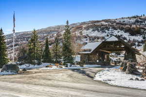 Exterior space featuring stone siding and a mountain view