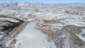 Snowy aerial view with a mountain view