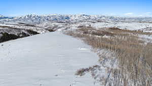 Snowy aerial view with a mountain view