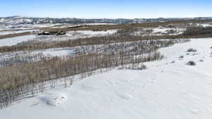 Snowy aerial view with a mountain view