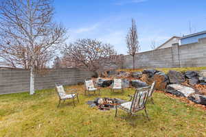 View of yard with a fire pit