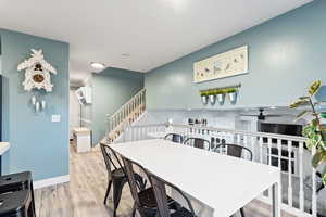 Dining area featuring light hardwood / wood-style flooring and ceiling fan